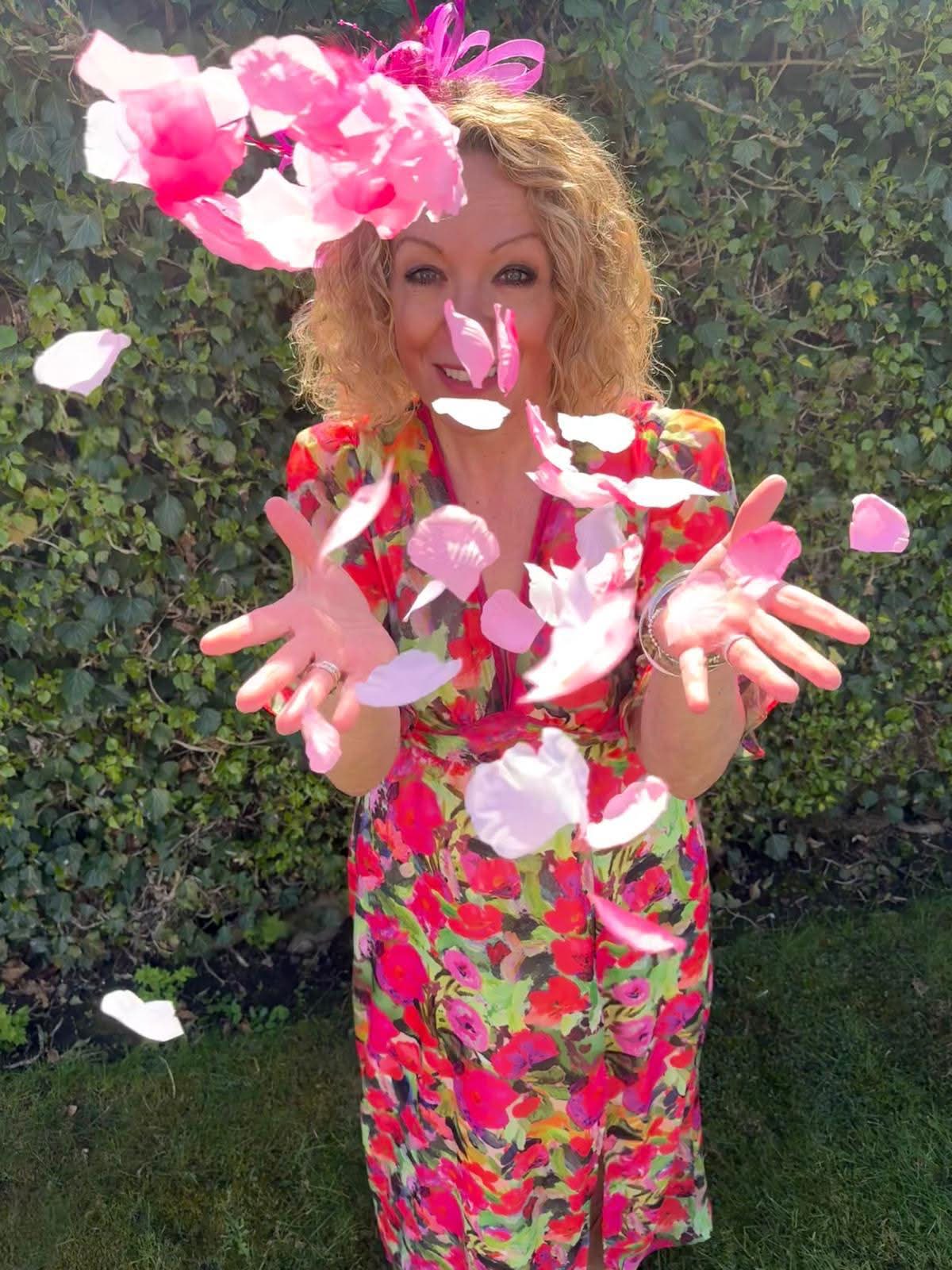Clare smiling warmly as confetti fills the air around her — full of joy and personality.