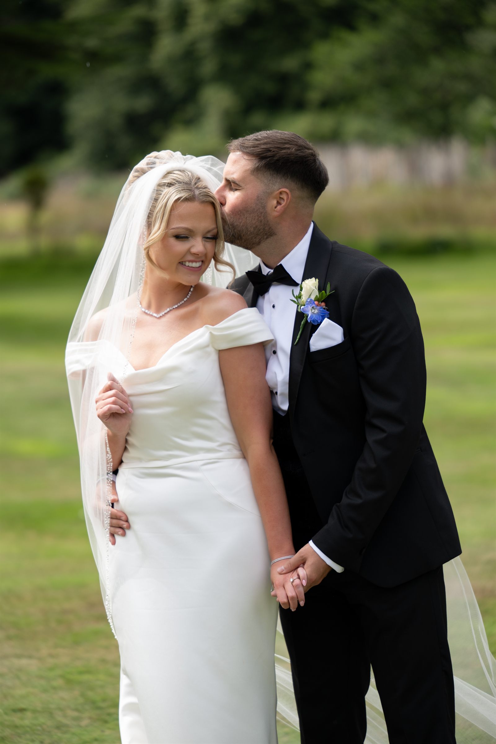A couple sharing a romantic portrait after their wedding ceremony.