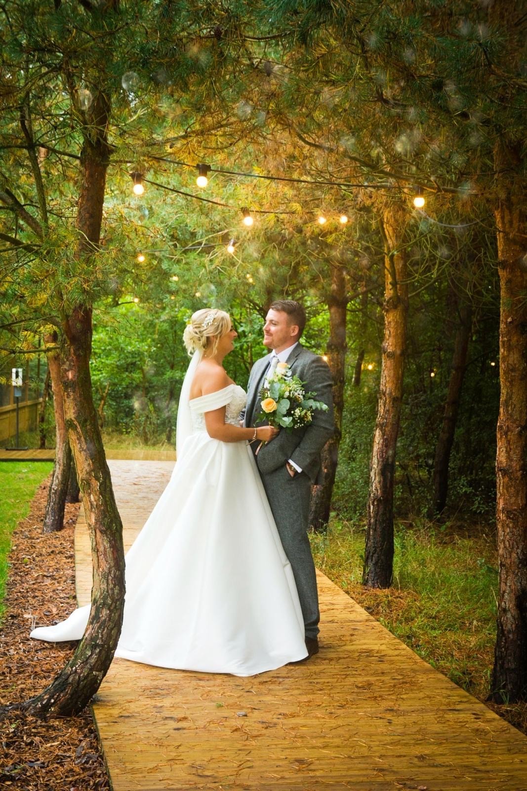 A wedding couple sharing a quiet moment together during their ceremony.