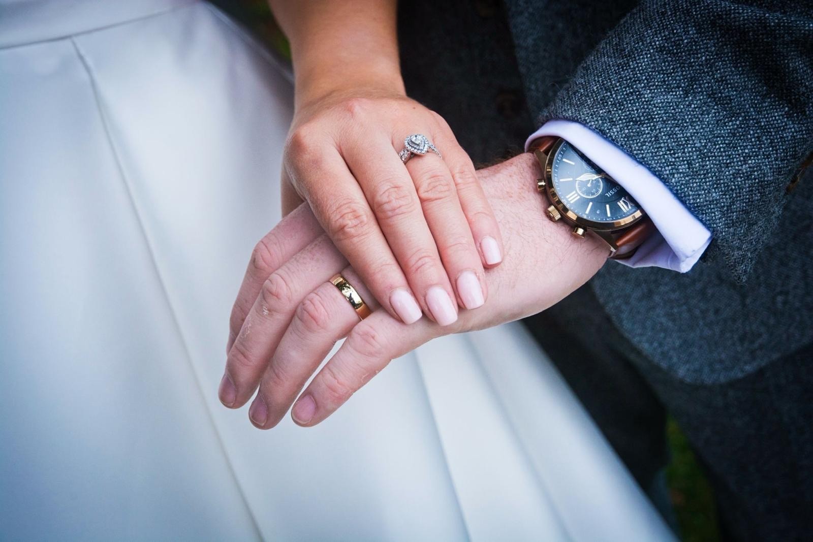 Wedding rings and ceremony details arranged elegantly.
